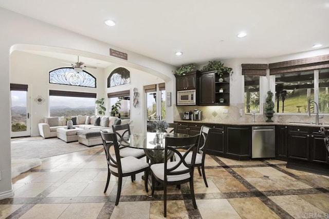 dining room featuring sink and ceiling fan