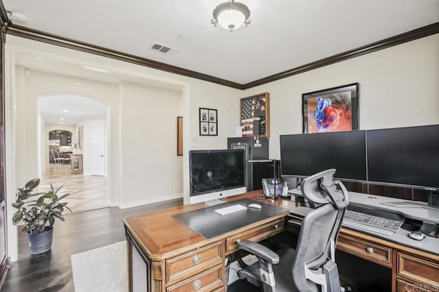 office with ornamental molding and dark hardwood / wood-style floors