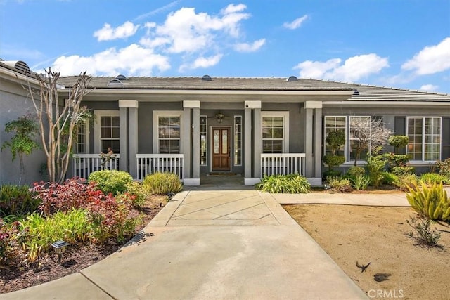 doorway to property with covered porch