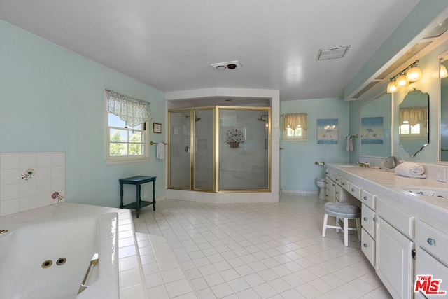 full bathroom featuring vanity, tile patterned flooring, plus walk in shower, and toilet