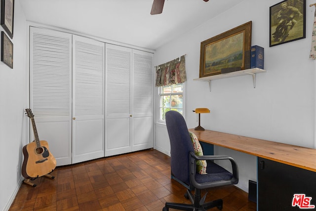 office space with ceiling fan and dark parquet floors