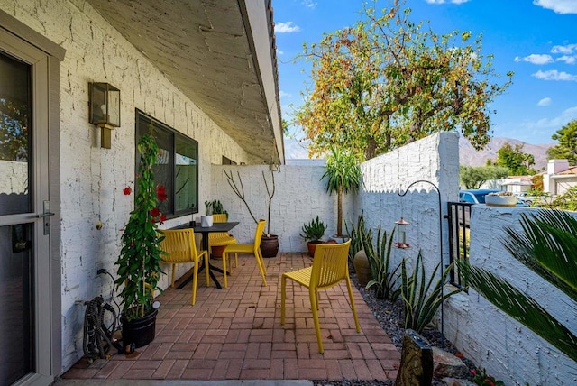 view of patio / terrace with a mountain view