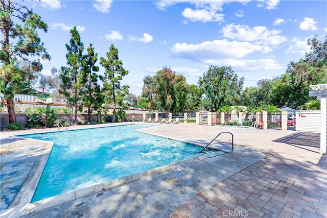 view of swimming pool with a patio area