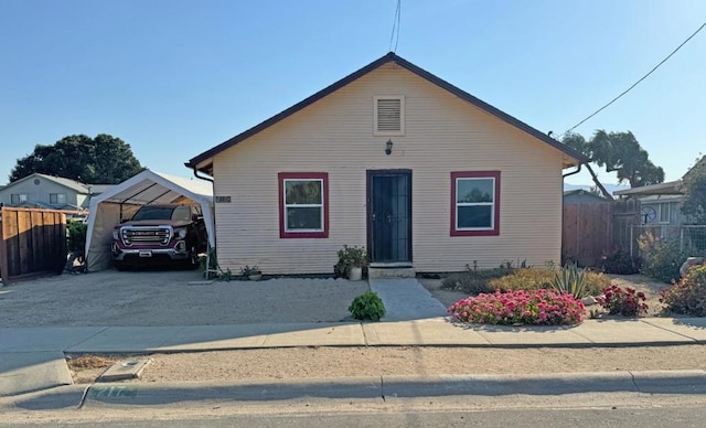 bungalow-style home with a carport