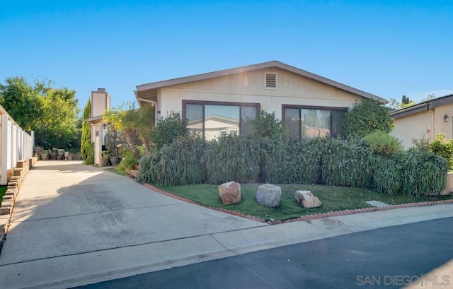 view of home's exterior with a lawn