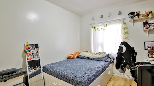 bedroom with light hardwood / wood-style floors