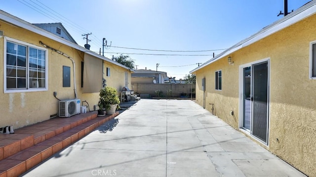 view of patio featuring ac unit