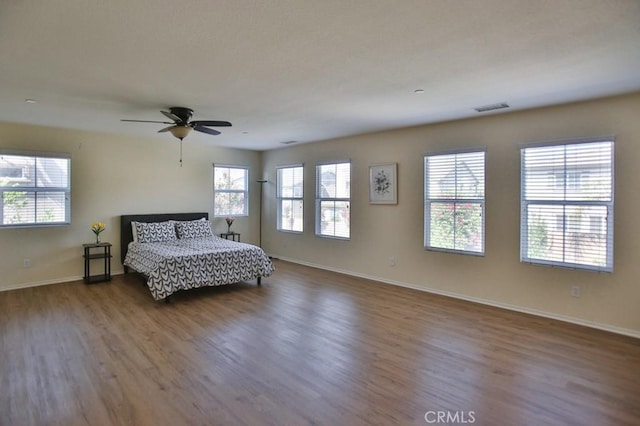 bedroom featuring hardwood / wood-style flooring and ceiling fan