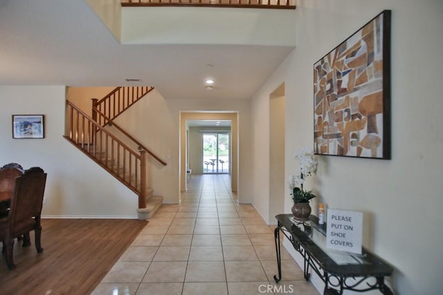 entryway featuring light tile patterned floors