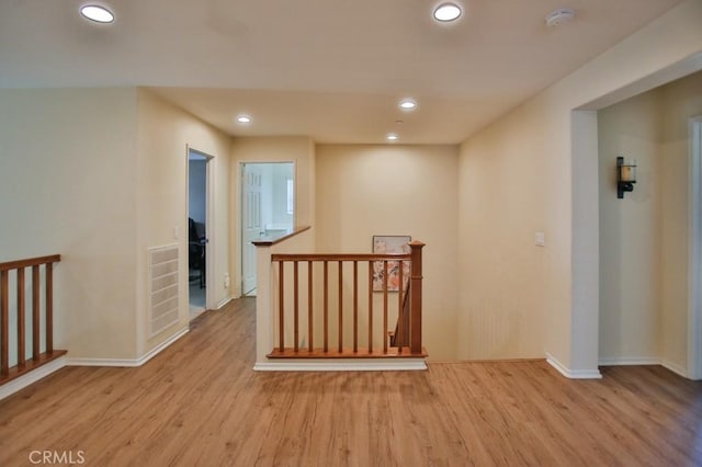 hallway with light wood-type flooring