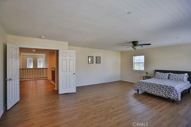 unfurnished bedroom with hardwood / wood-style floors and ceiling fan