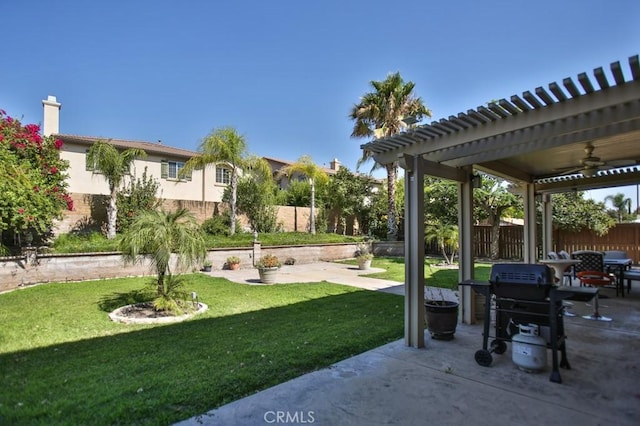 view of yard with a pergola, a patio area, and ceiling fan