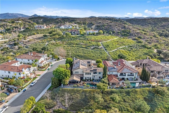 birds eye view of property featuring a mountain view