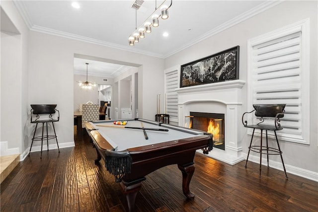 game room with dark wood-type flooring, billiards, and ornamental molding