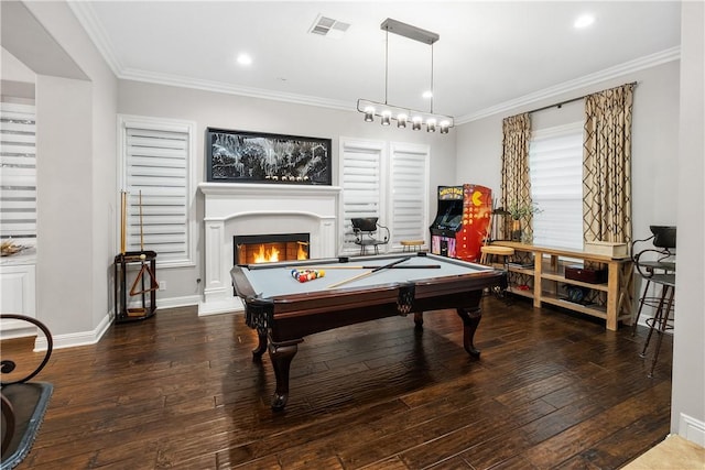 recreation room with pool table, ornamental molding, and dark hardwood / wood-style flooring