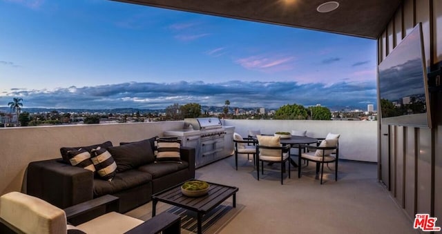 view of patio / terrace with an outdoor living space and a grill