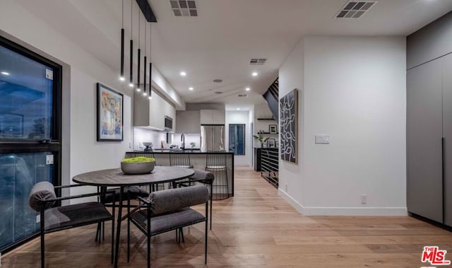 dining area with light hardwood / wood-style flooring