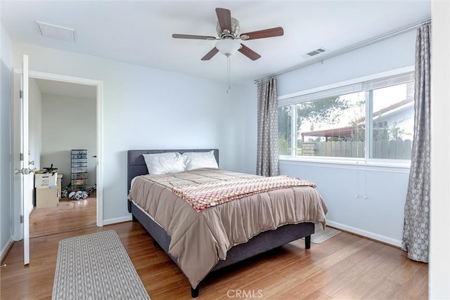 bedroom featuring hardwood / wood-style flooring and ceiling fan