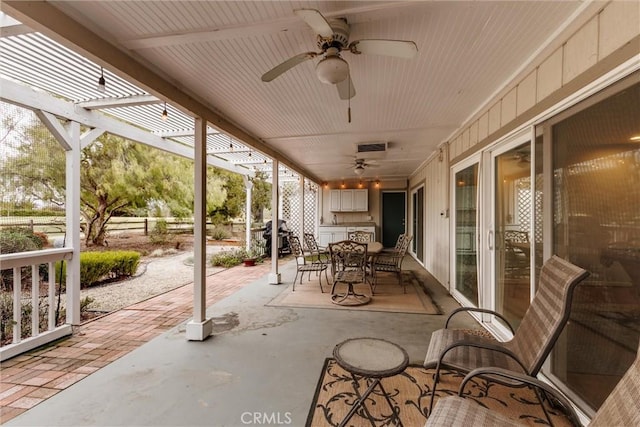 view of patio / terrace featuring ceiling fan