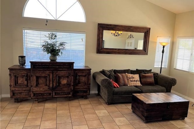 living room featuring light tile patterned floors and baseboards