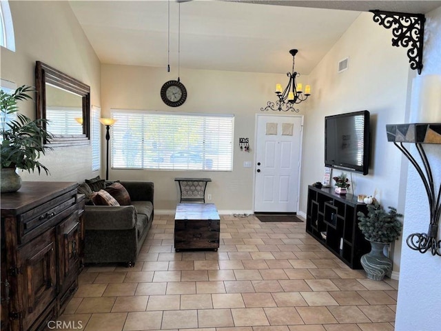 entryway with visible vents, baseboards, an inviting chandelier, and light tile patterned flooring