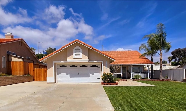 view of front of house featuring concrete driveway, a tiled roof, covered porch, fence, and a front lawn