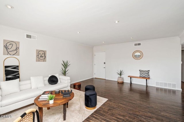 living room featuring ornamental molding and dark hardwood / wood-style flooring