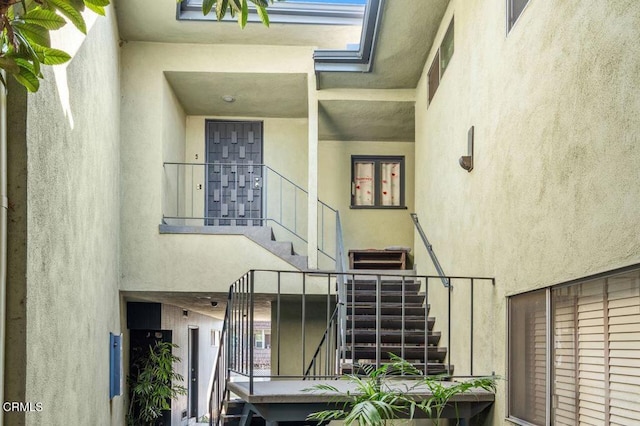 stairs featuring a high ceiling