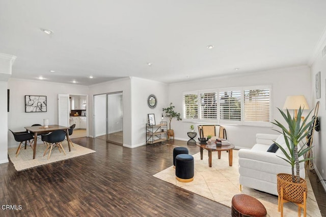 living room featuring dark hardwood / wood-style flooring and ornamental molding