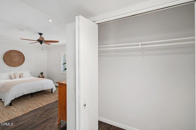 bedroom with dark wood-type flooring and ceiling fan