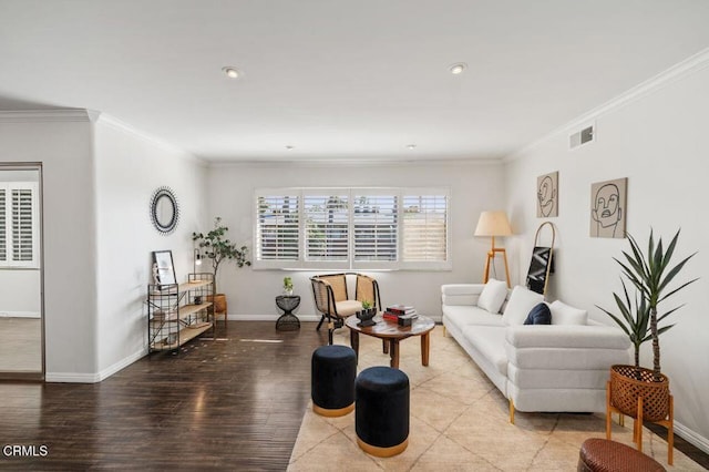 living room with light hardwood / wood-style flooring and ornamental molding