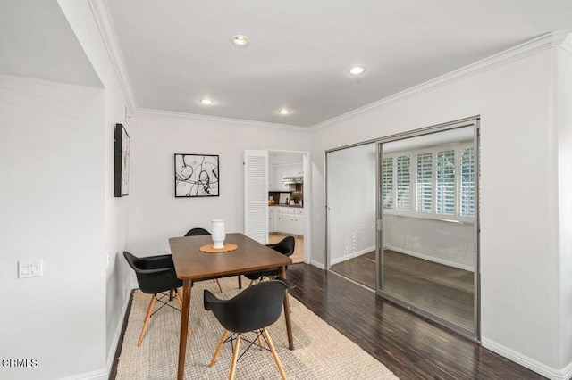 dining space with crown molding and dark wood-type flooring