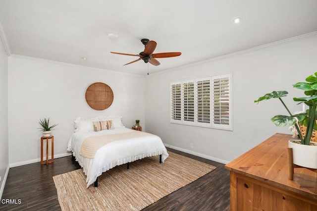 bedroom with crown molding, dark wood-type flooring, and ceiling fan