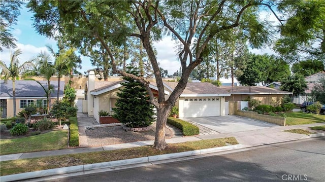 ranch-style home featuring a garage