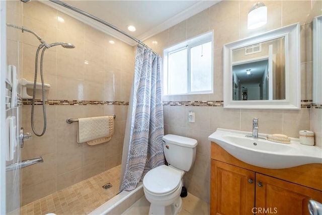 bathroom with tile walls, vanity, ornamental molding, walk in shower, and toilet