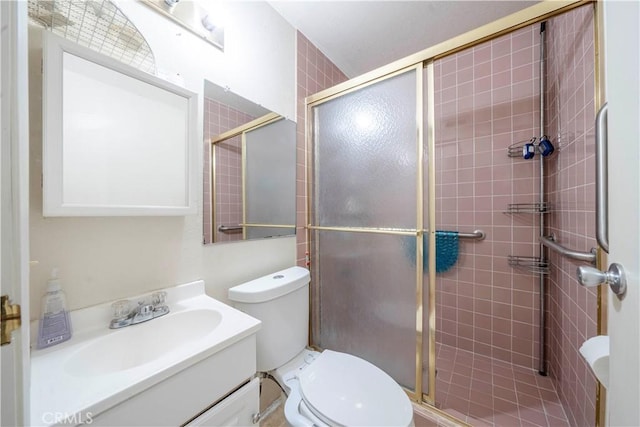 bathroom with vanity, toilet, and walk in shower