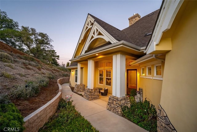 view of property exterior at dusk