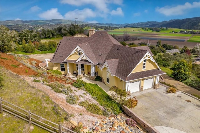 drone / aerial view featuring a mountain view