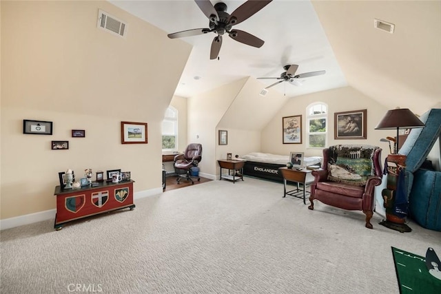 living area featuring vaulted ceiling, ceiling fan, and carpet