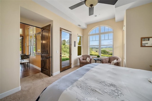 carpeted bedroom featuring access to outside and ceiling fan