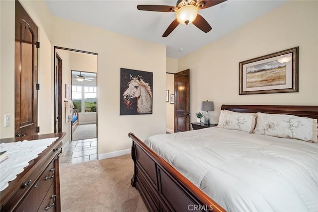 bedroom with ceiling fan and light carpet