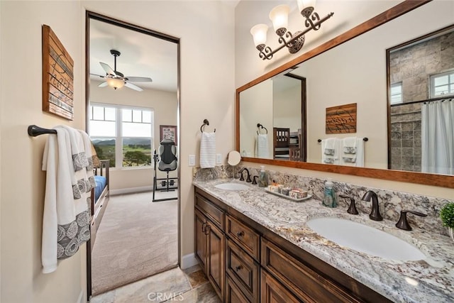 bathroom featuring vanity, ceiling fan, and walk in shower