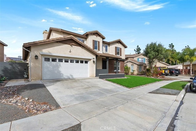 view of property with a garage and a front lawn