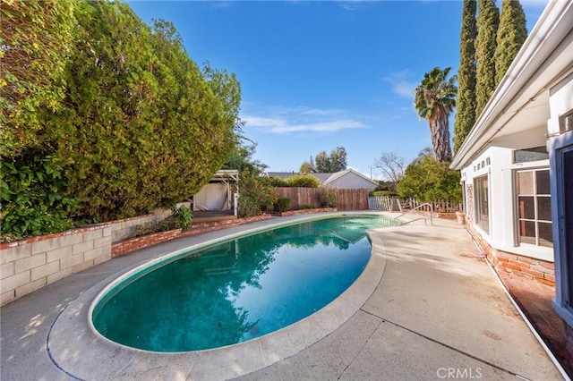 view of swimming pool featuring a patio