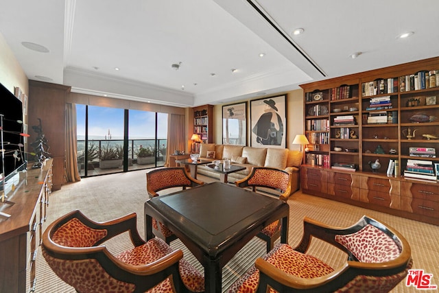 carpeted living room featuring crown molding