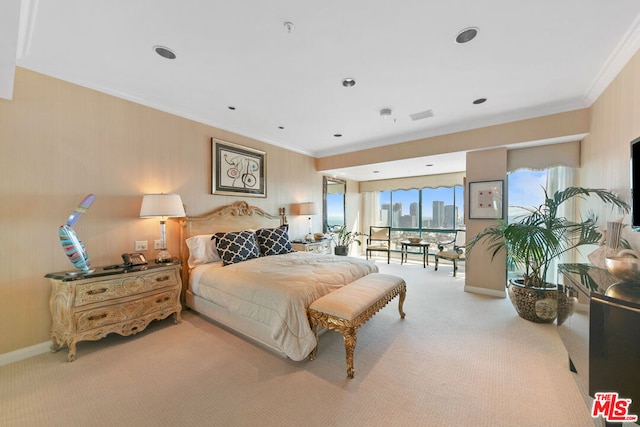 bedroom with crown molding, light colored carpet, and access to exterior