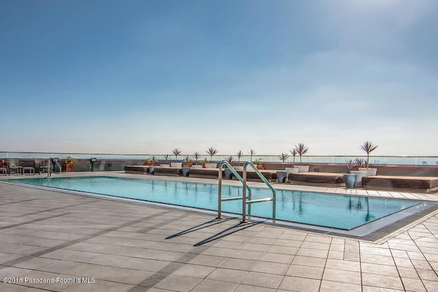 view of pool featuring a patio area