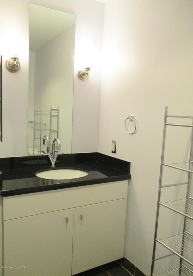 bathroom with vanity and tile patterned floors