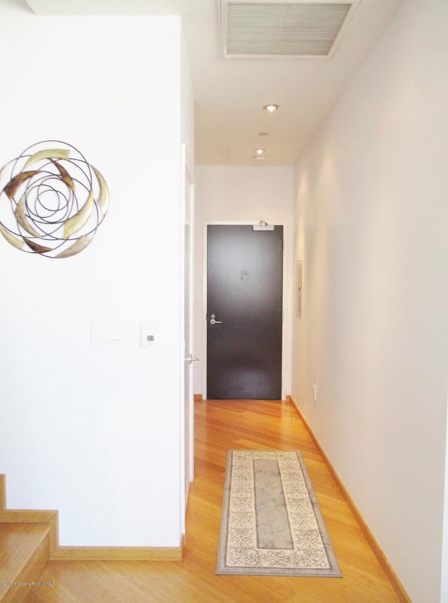 hallway with light wood-type flooring