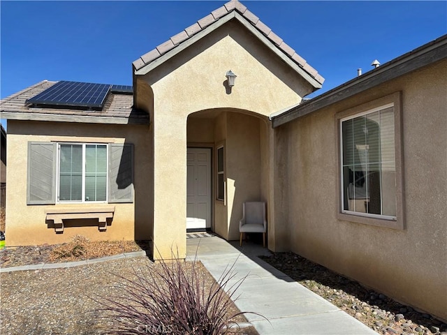 property entrance featuring solar panels